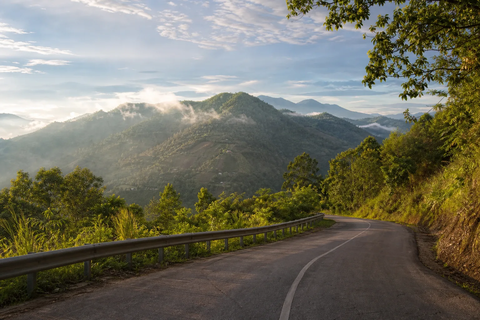Ranau Sabah misty highland route with green hills and scenic road